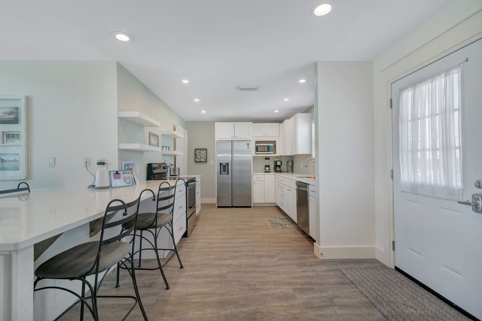 Kitchen with quartz countertops and custom self closing cabinets