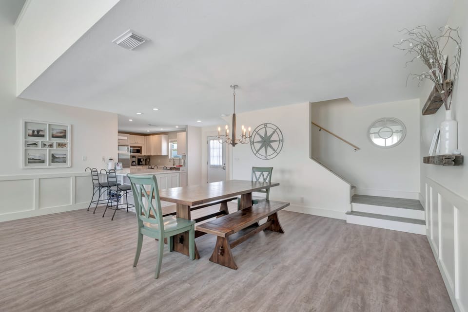 view from living room to the kitchen and loft stairs