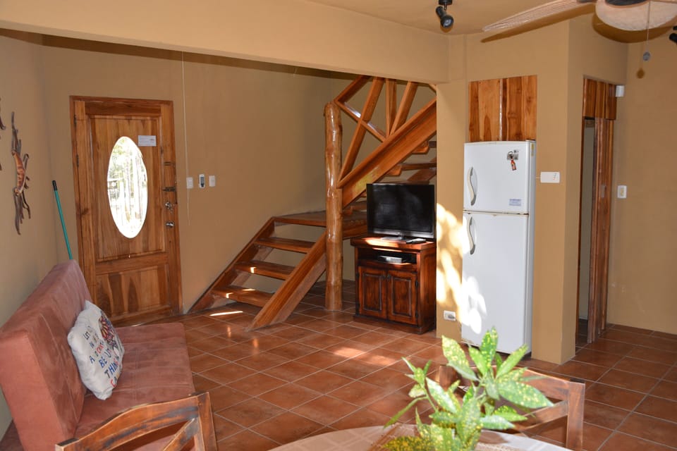 entrance, living area and stairs to loft - Villa Cocobolo