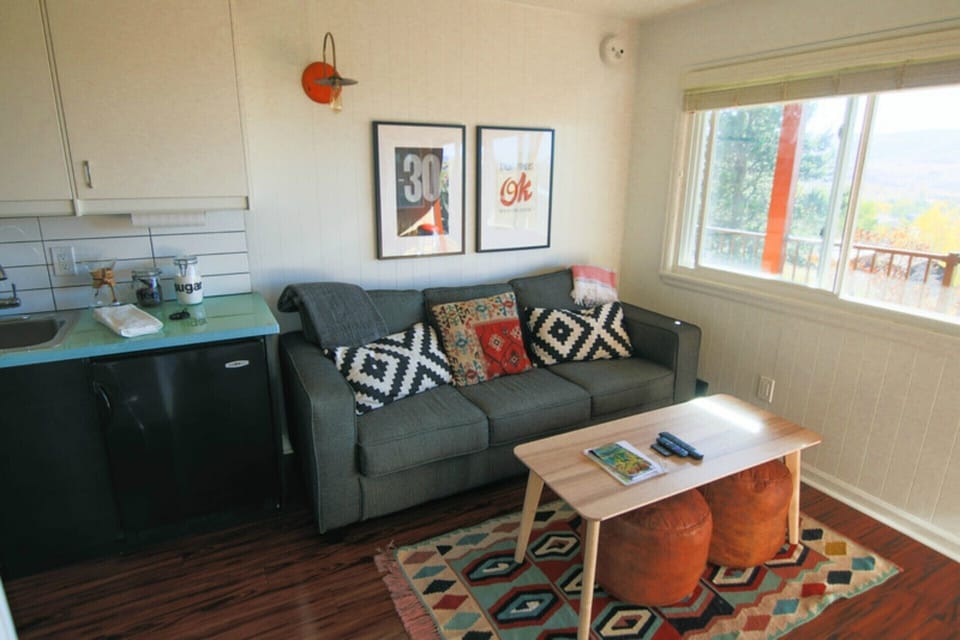 Queen Sofa Couch, Moroccan Poufs, Turkish Rug, and Orange Light from Israel