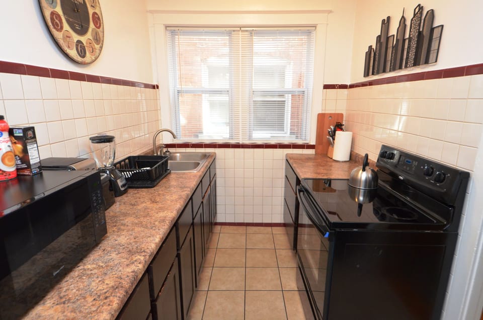 Kitchen With Everything Needed To Prepare And Serve A Meal