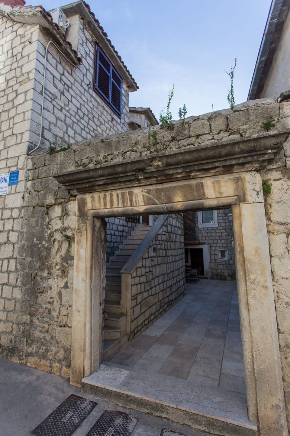 Entrance. 
Parking the car in front in the street