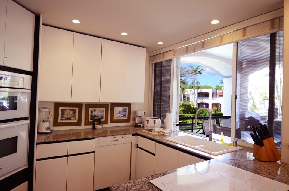 Fully equipped gourmet kitchen has everything you need. It opens to the lanai.