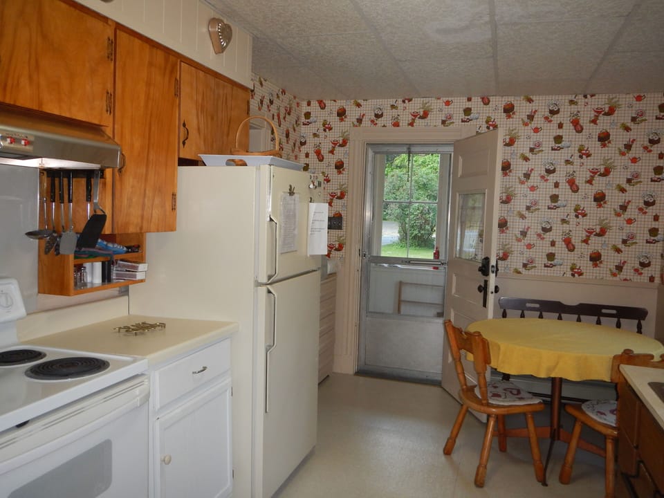 There is a small table in the kitchen for informal meals.