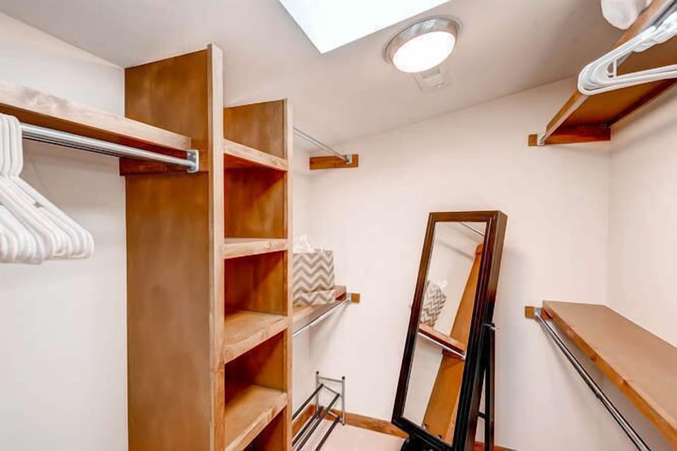 Master walk-in closet; standing mirror opens to hang jewelry or scarves