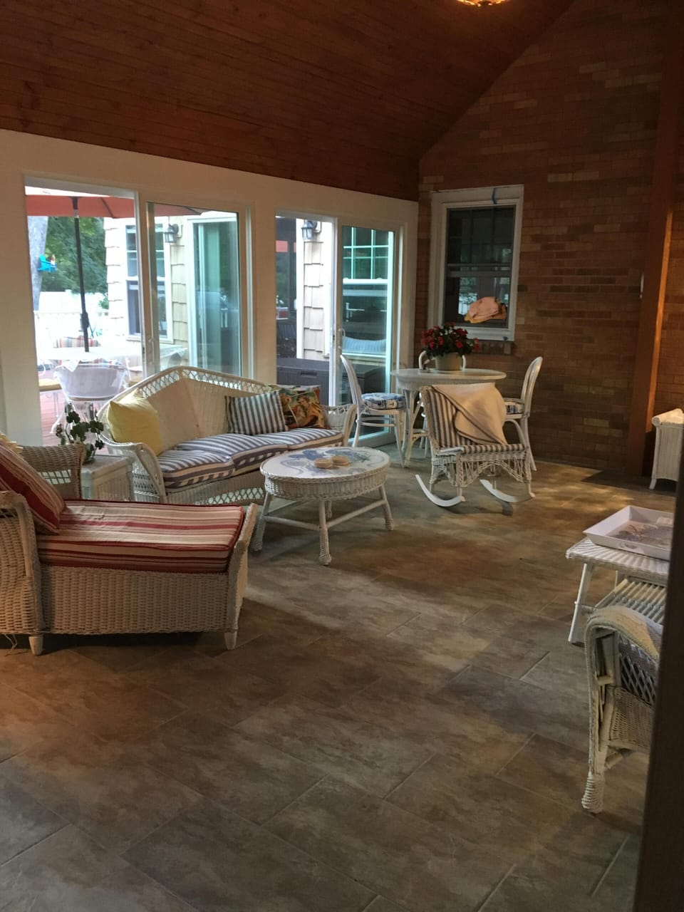 Delightful screened in porch plenty of comfy seating listening to Lake Michigan
