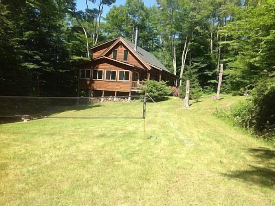 View from yard towards house - badminton and fire pit!