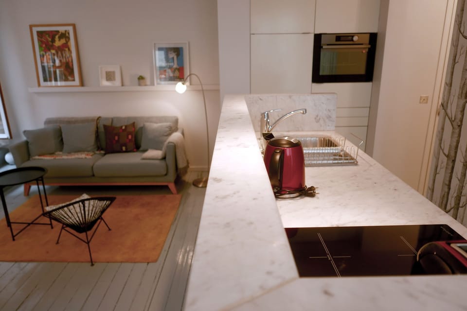 View of the living are and kitchen from the dining area