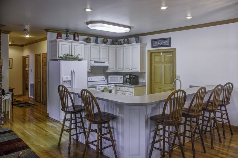 In addition to a dining room table, we have bar seating that will seat up to 6.