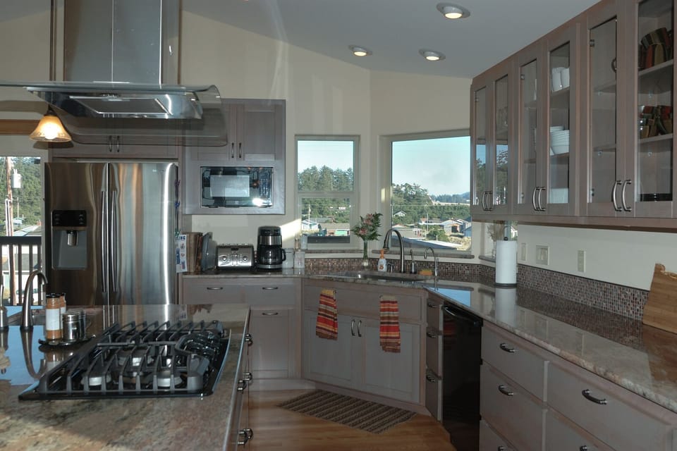 Gas 5 burner cooktop, double oven, large fridge with two icemakers, large sink plus extra prep sink, quiet Bosch dishwasher, BBQ on morning deck, and the list goes on....