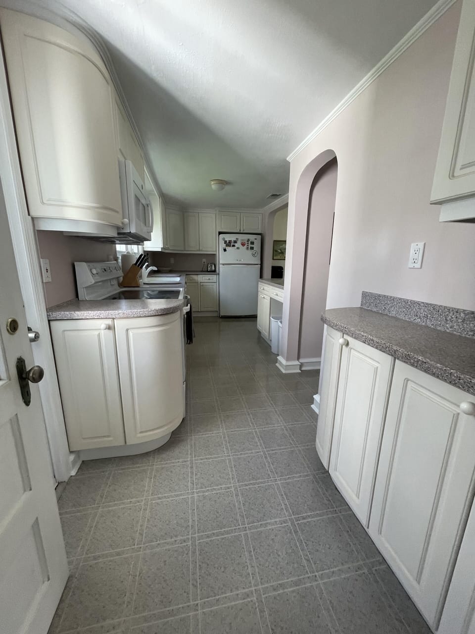 Another view of the kitchen with extra countertops and storage