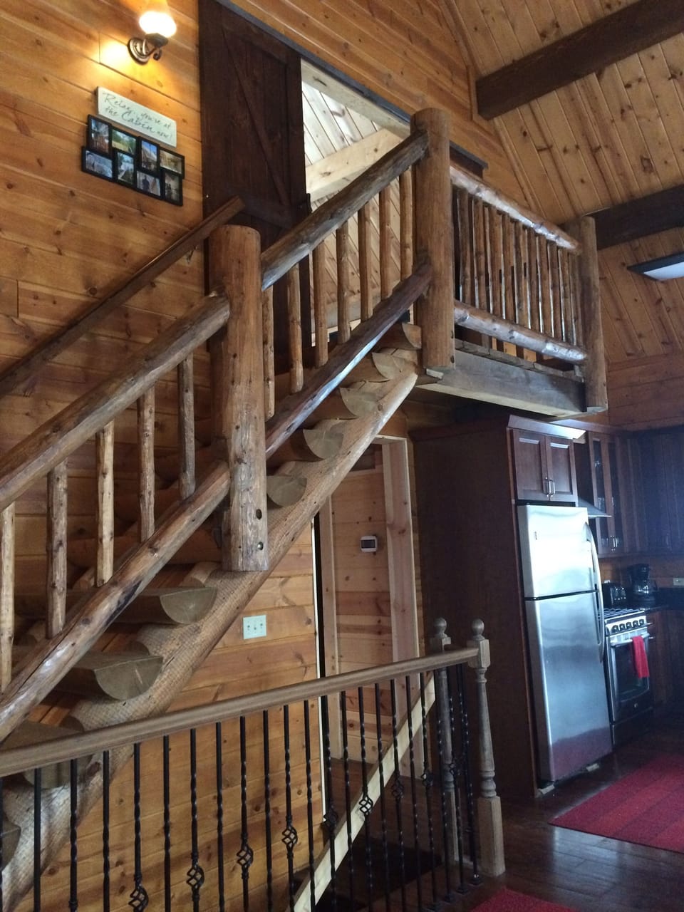 Stairway upstairs to master bed/bath;two beds/bath through doorway on main level