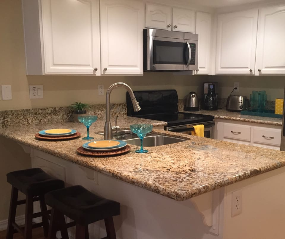 Breakfast bar and fully stocked kitchen.