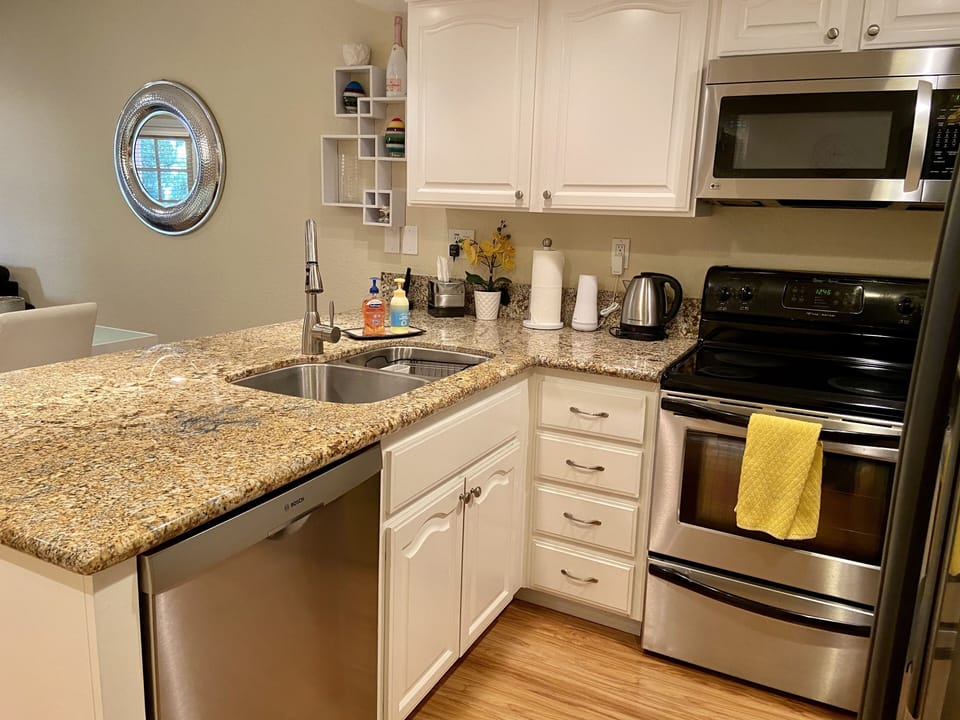 Our kitchen overlooks the dining room and has a breakfast bar. 