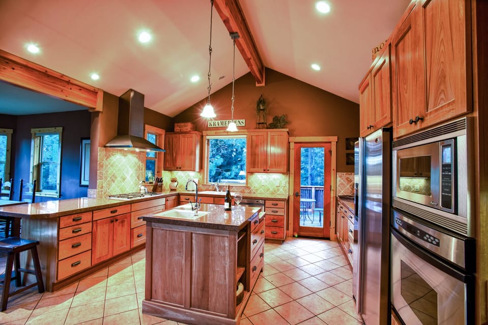Kitchen with views from all angles. Large enough for a group gathering.