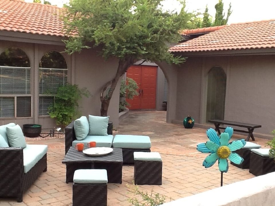 Relaxing comfortably in the courtyard while enjoying red rock views.