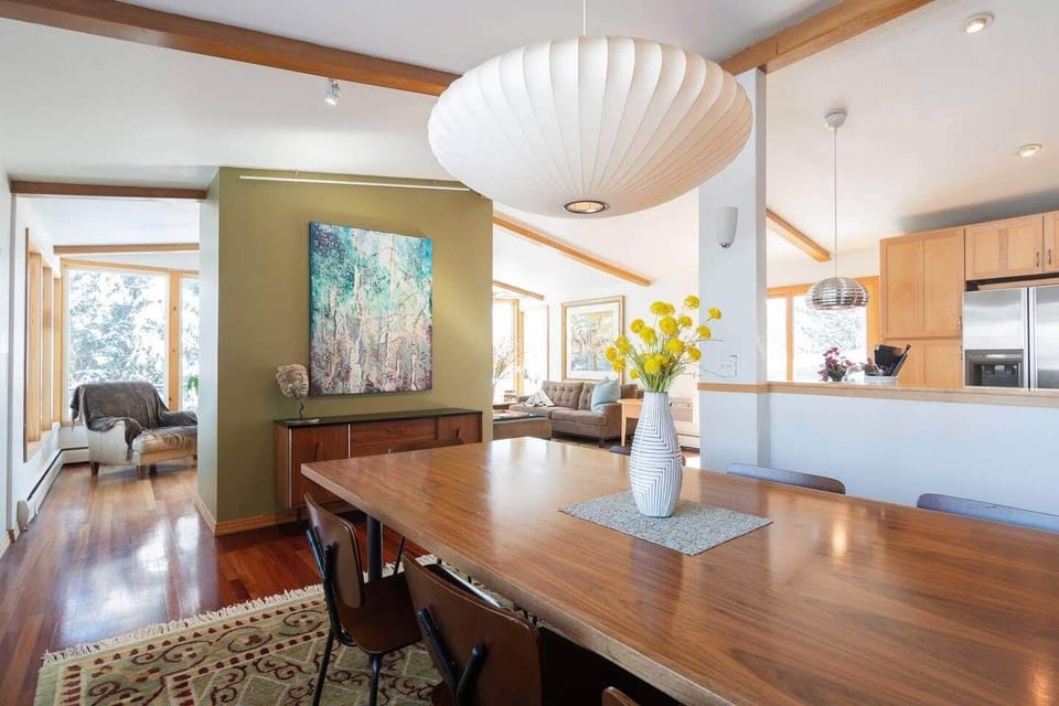 Custom dining table comfortably seats 8.  Plenty of room for puzzles & games.