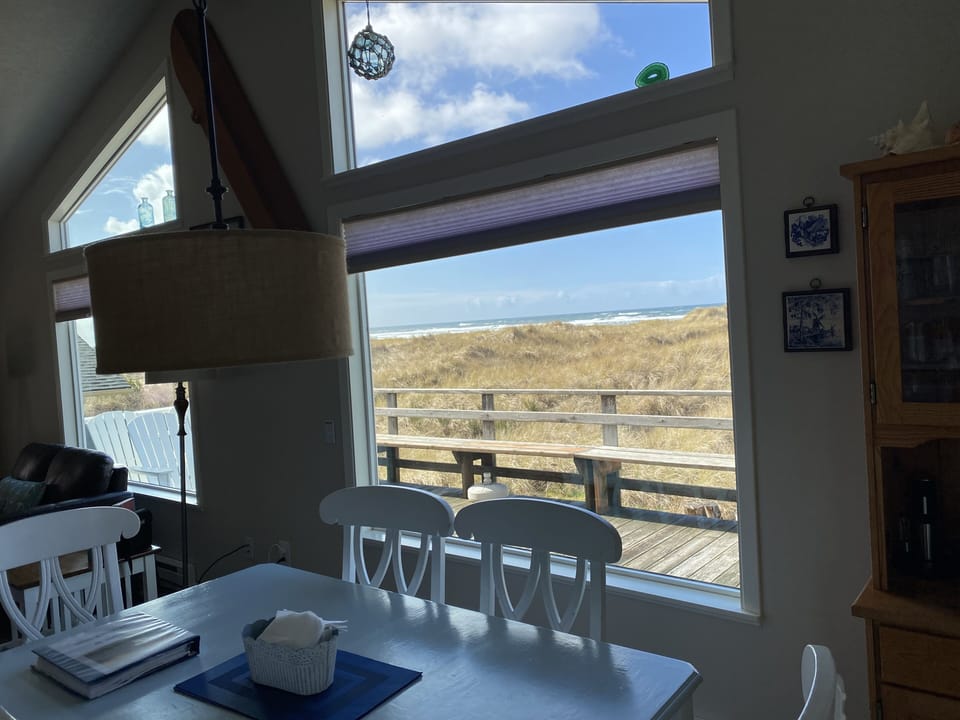 Dining Area with outside deck.  Ocean views while you share meals.