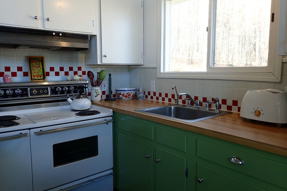 Kitchen including toaster, microwave and coffee maker