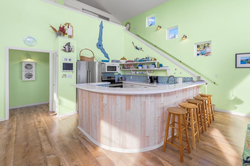 Kitchen/bar view with doorway to 2 bedrooms and 2 bathrooms!