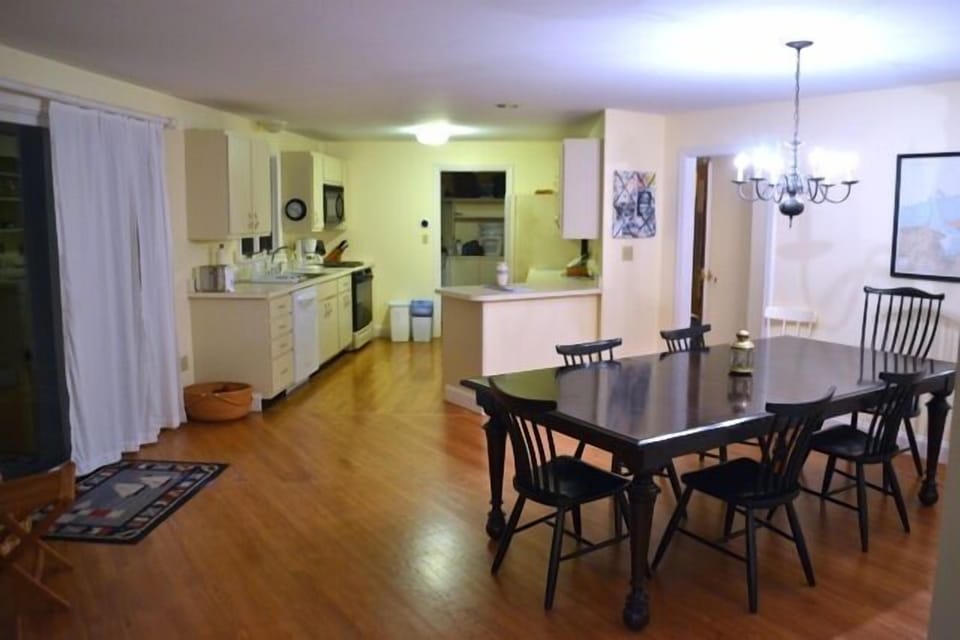 View of dining area and kitchen.  Laundry room is through the far doorway.