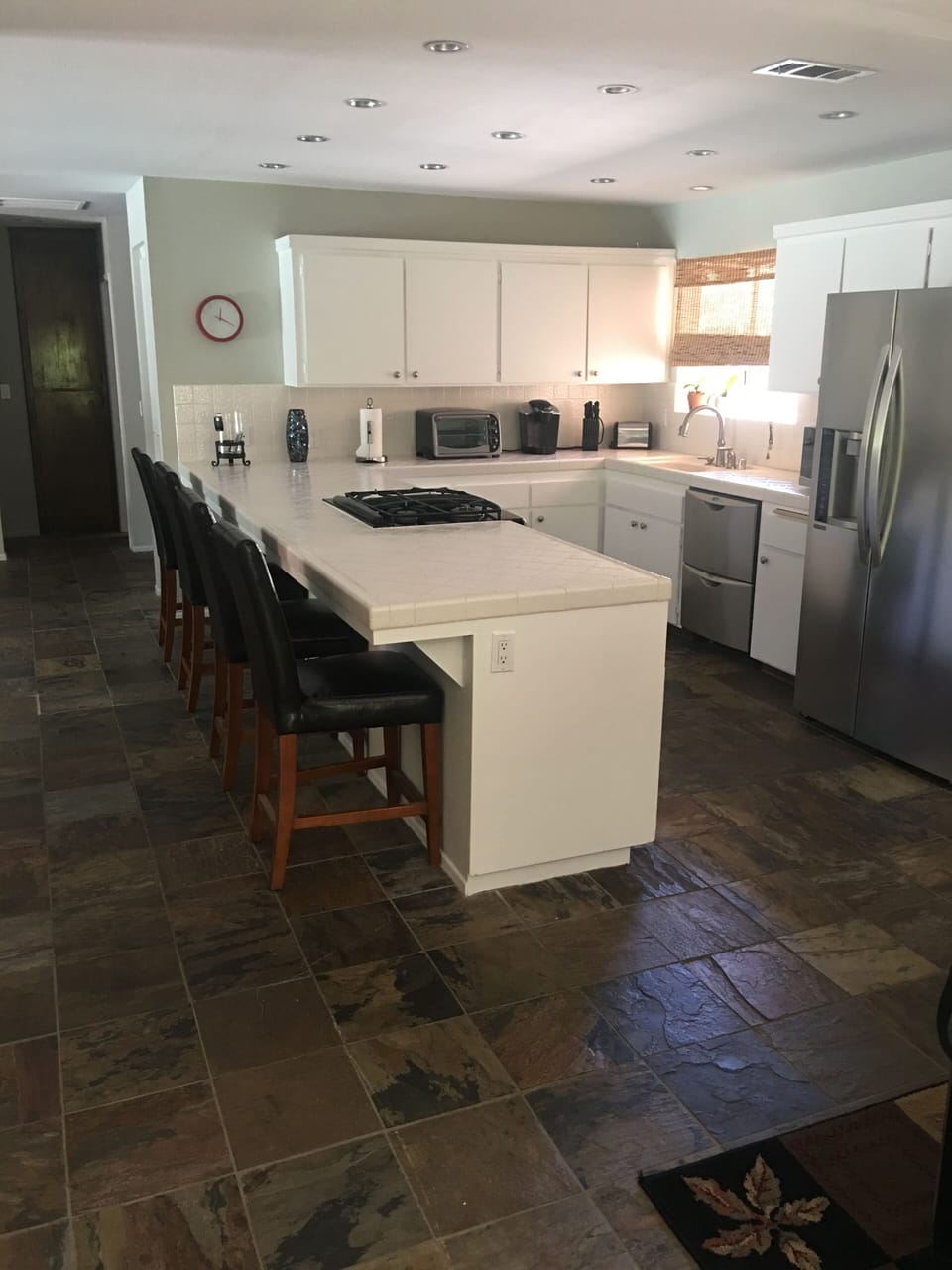 Open concept kitchen with stainless steel appliances and dual dishwashers
