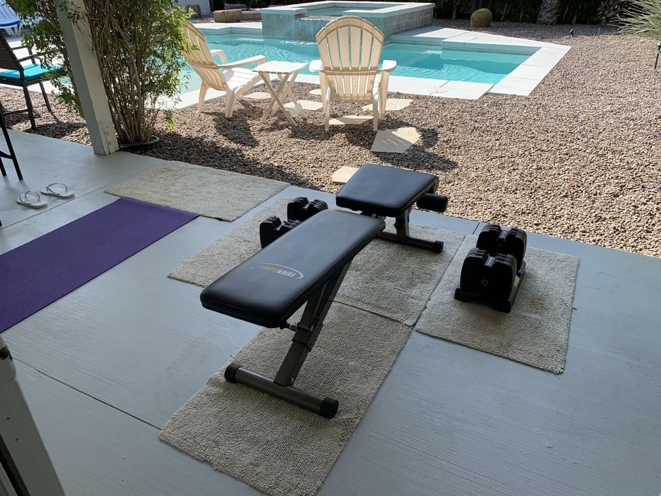 Yoga, stretching, and work-out area with BowFlex weights adjustable from 5-60 lb