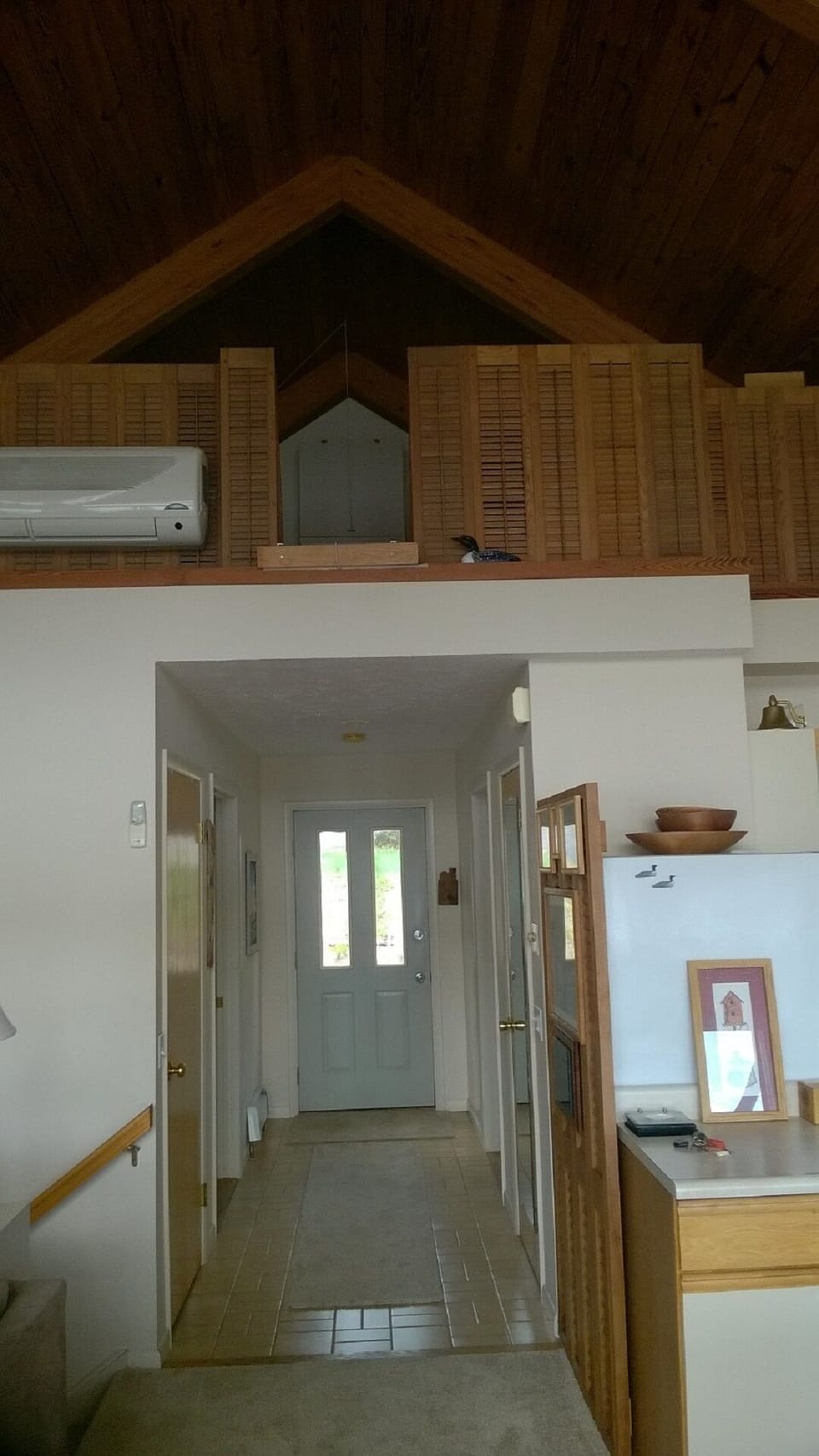 Front entry hall on main living level - den left, laundry room full bath right