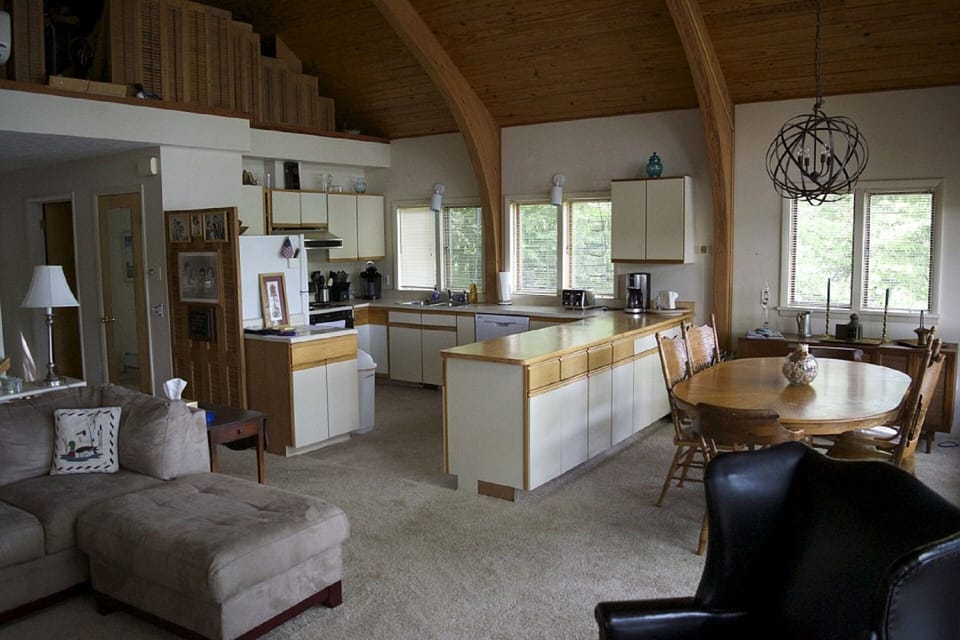 Open concept Kitchen dining area from living room. All looking over water