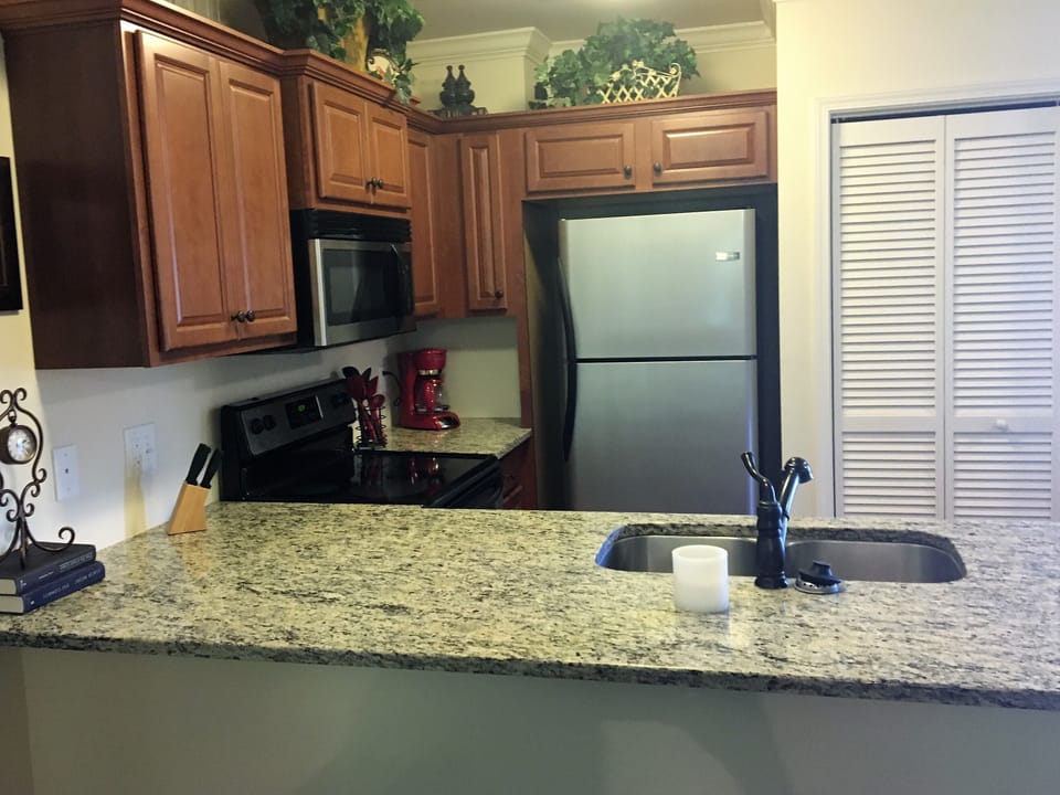 Granite counter tops and modern appliances throughout the condo.