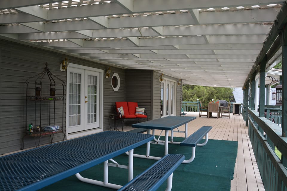 Enjoy the View -  Porch w/ Two 12 Person Picnic Tables, Rockers, & Love Seat