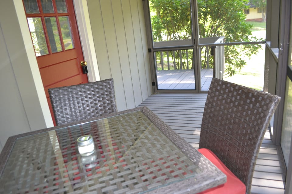 Screened in porch for relaxing and gathering.