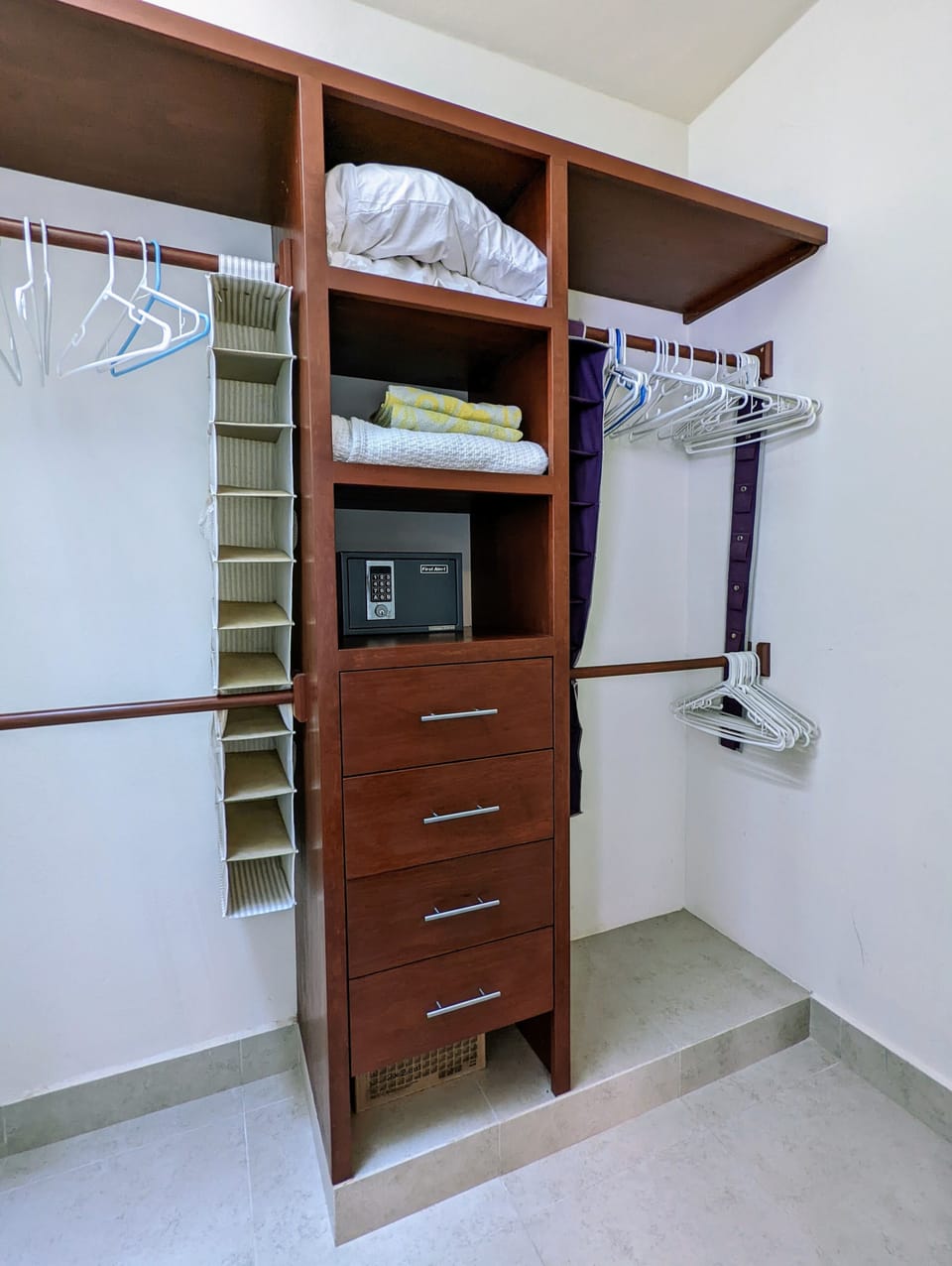 Primary bedroom's closet with personal safe.