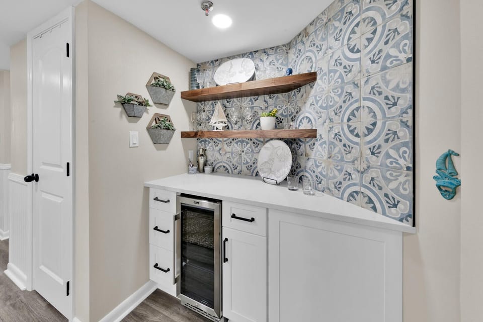 New wet bar with drink fridge, bottle openers, corkscrews & misc. bar supplies. 