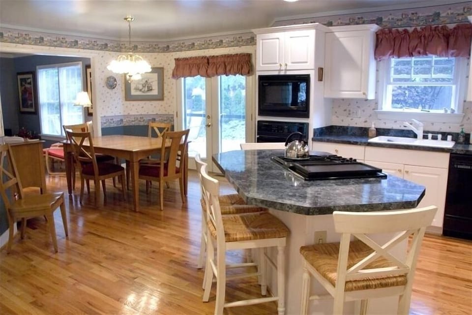 Kitchen & dining area will seat 10 people comfortably.  2 refrigerators in home.