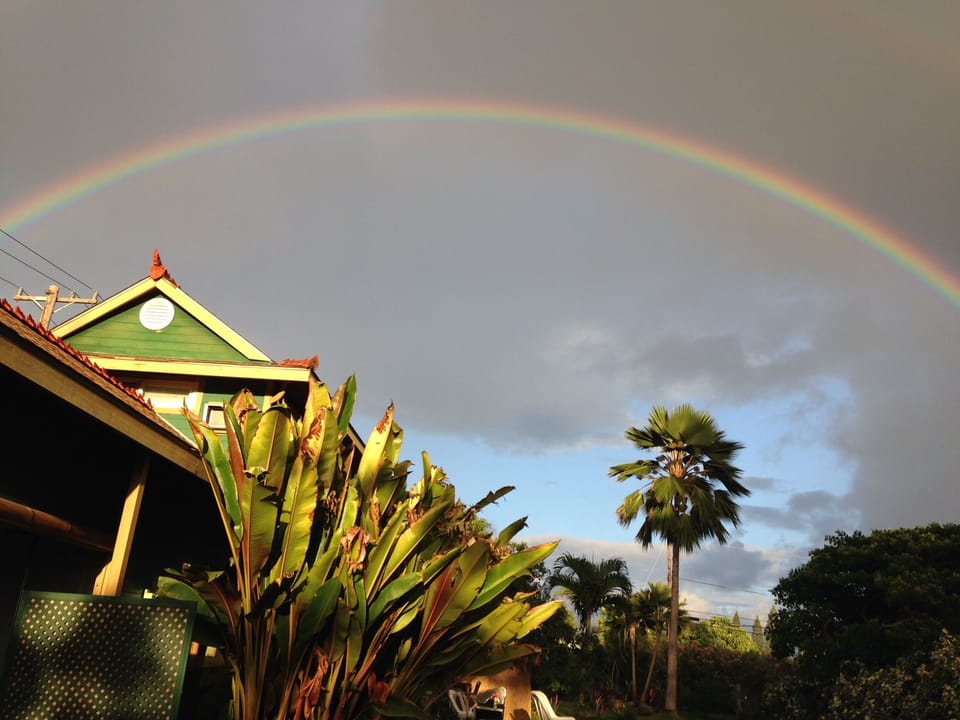 Rainbow over house