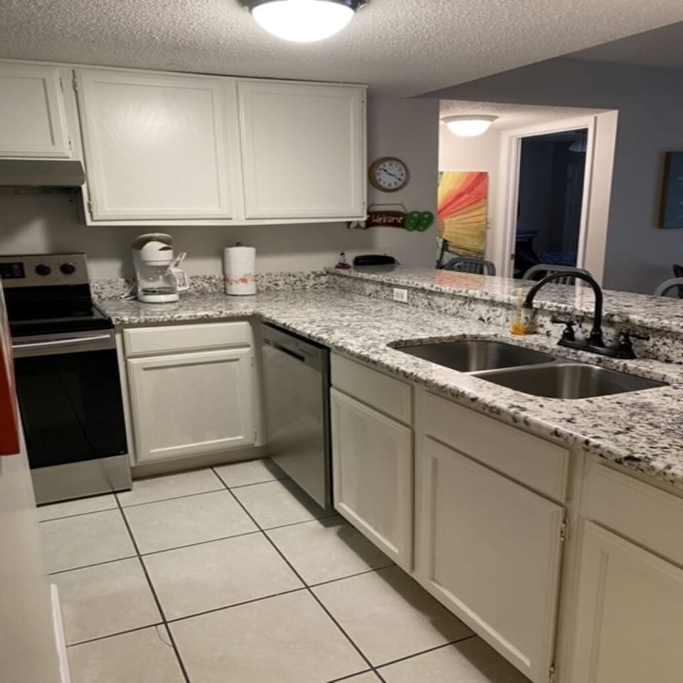 Kitchen with granite and stainless steel appliances