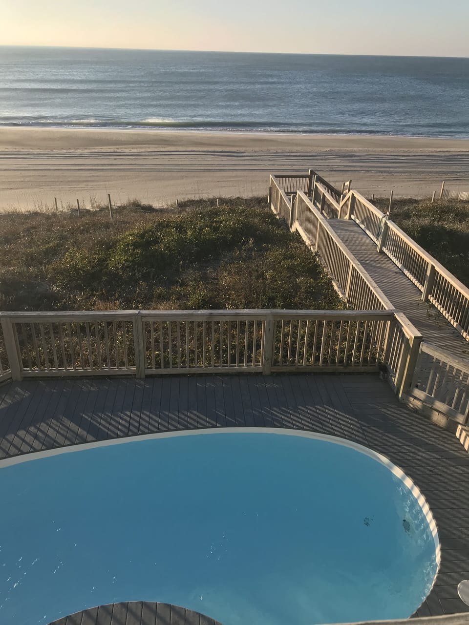 Walkway to Beach. Also shows gate and how pool is exclusive to the East side.