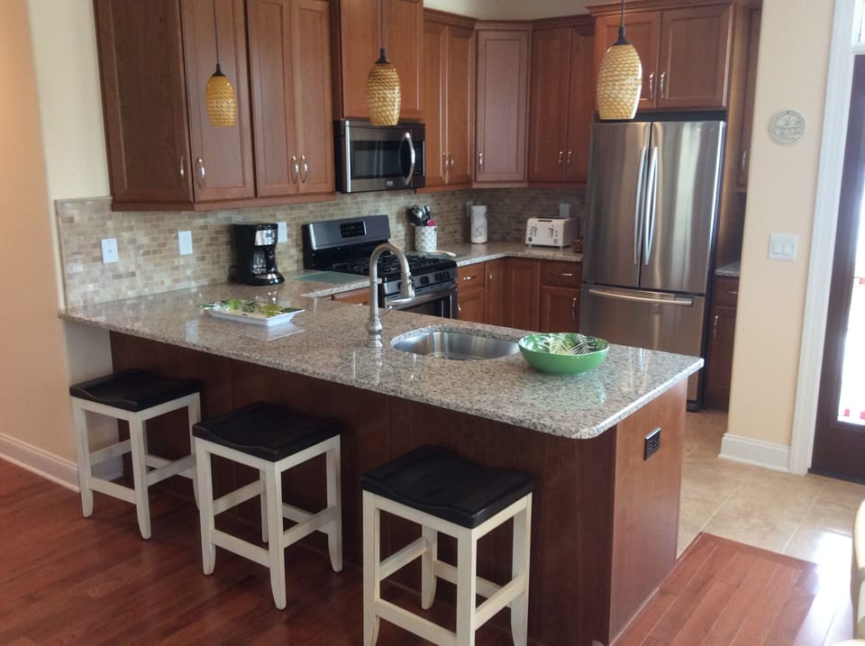 Enjoy pleasant conversation while preparing meals in the kitchen.