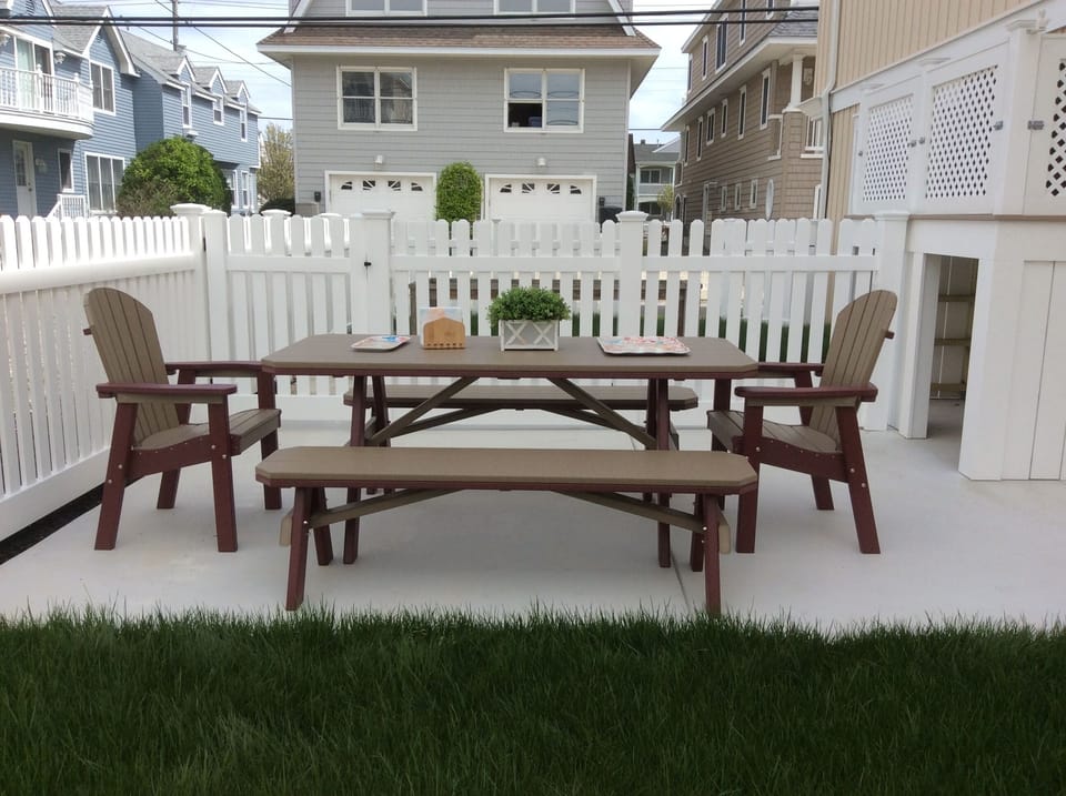 Enjoy a meal outside in the enclosed backyard.