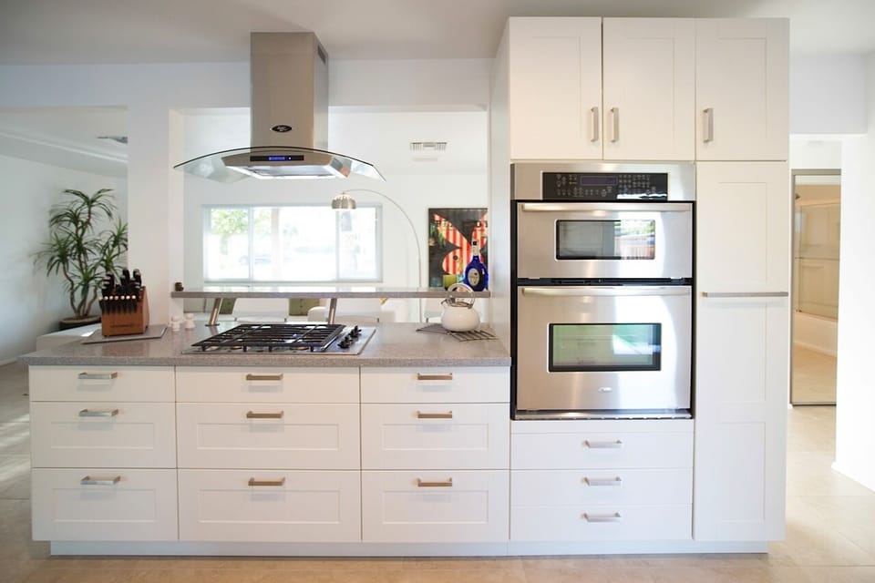 Wall Mounted Microwave and Oven, Massive Pull-Out Pantry with tons of storage.