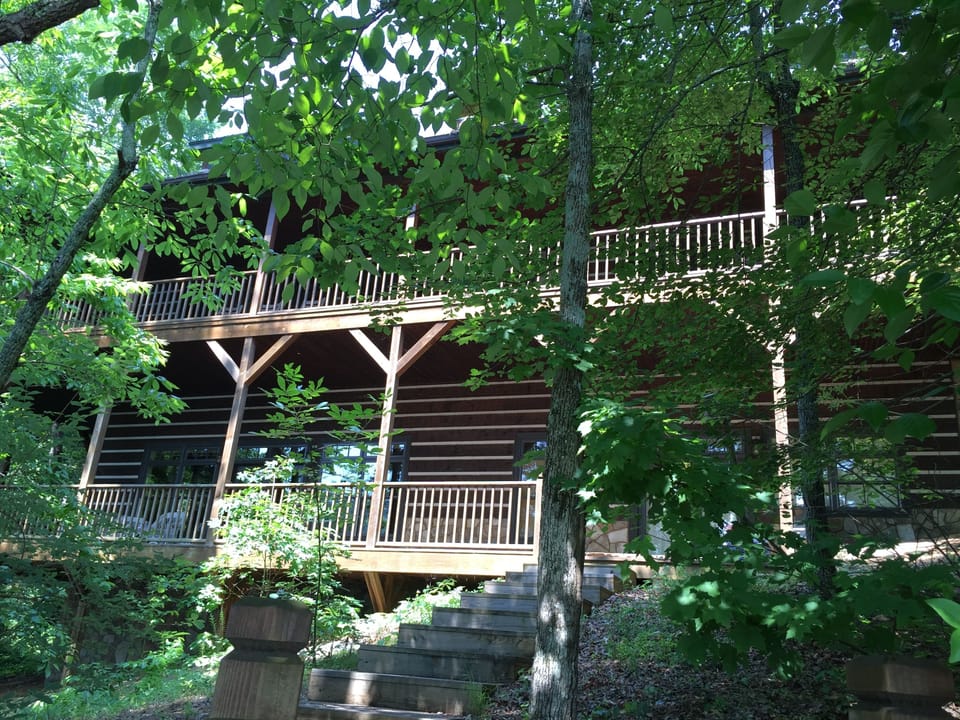 The main house offers great views and is just a few steps from the lake!