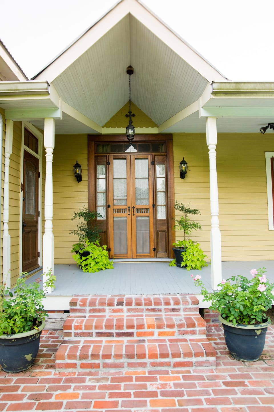 The entrance of the
house has  homemade
Cypress Screen doors.