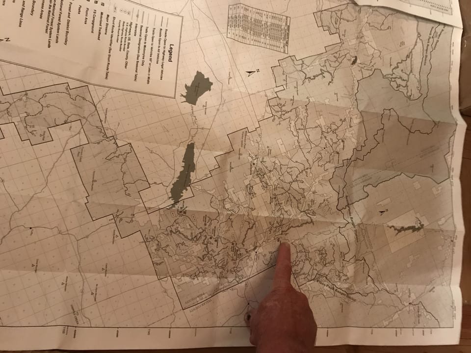 Finger is pointed at Cabin location, note all the trails around cabin to ride