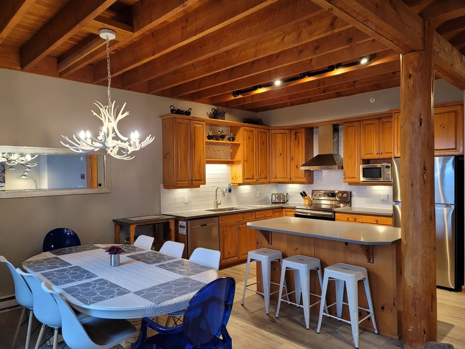 Renovated kitchen with stainless appliances and quartz counters