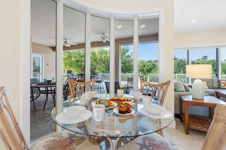 Enjoy breakfast in this cozy nook surrounded by a curved wall of windows.