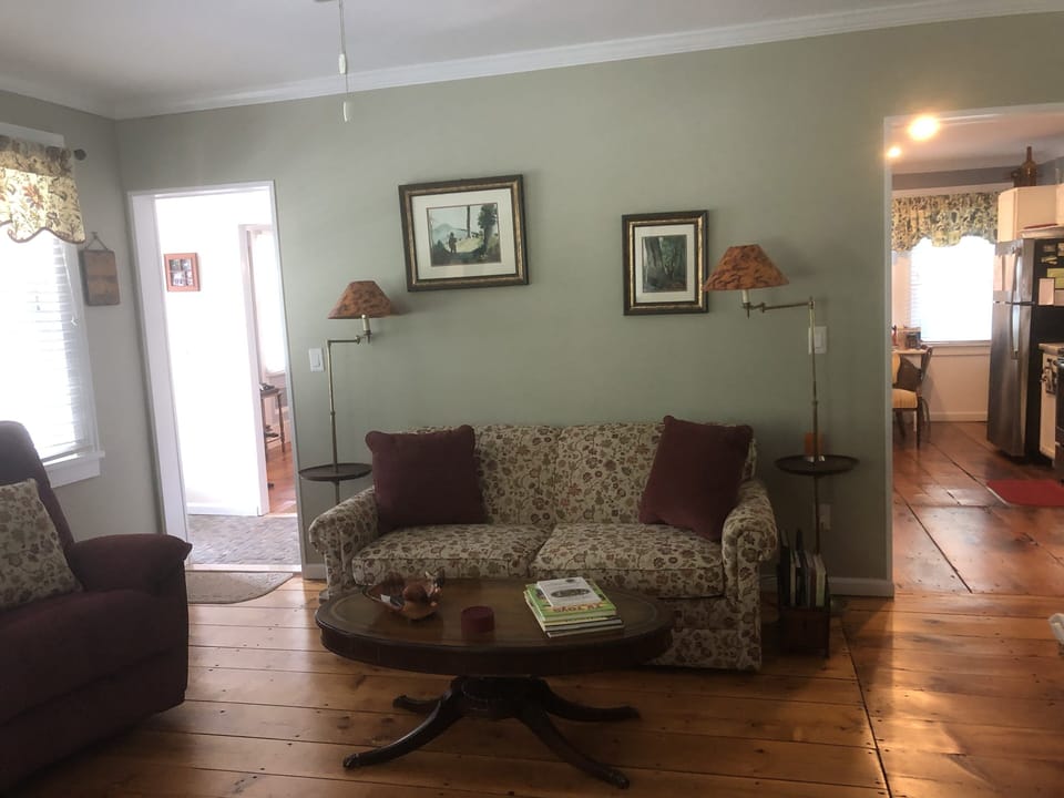 Living room with recliners, plenty of seating, gas fireplace and smart TV.