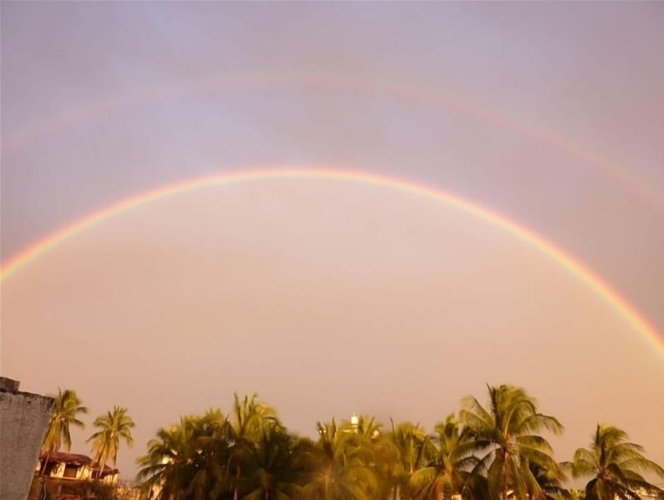 View of double rainbow from rooftop deck