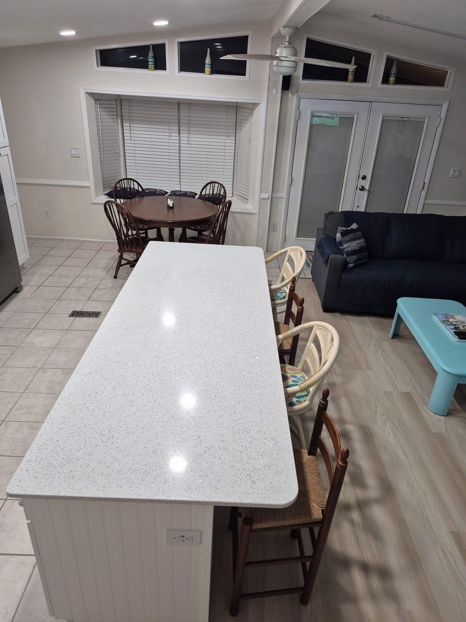 4 Bar Stools at island, plus 4 chairs at table (2 additional chairs/leaves)