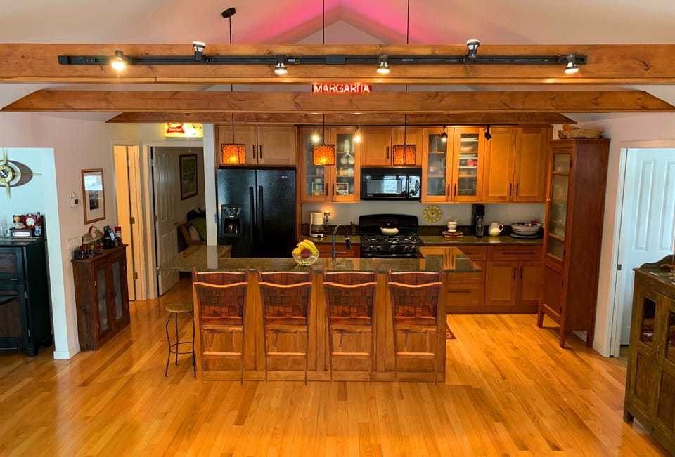 Fully equipped kitchen view from living room, open floor plan